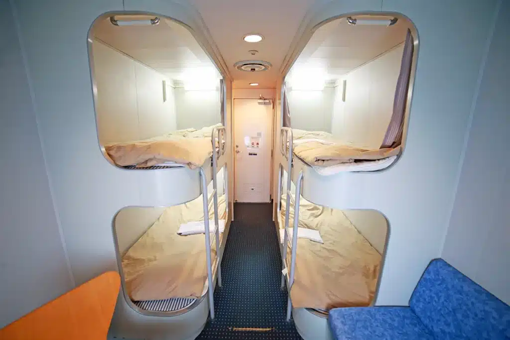 Reading lights and bedding for each bed in the New Camellia 1st Class Quad Cabin